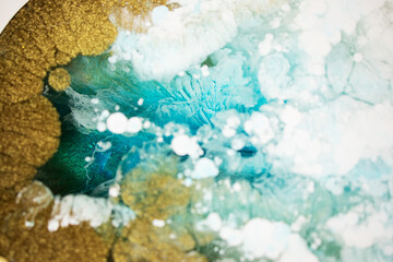 Abstraction. Ocean. Sea. Fluid art. Natural luxury. The style includes swirls of marble or ripples of agate. Very beautiful blue paint with the addition of gold powder