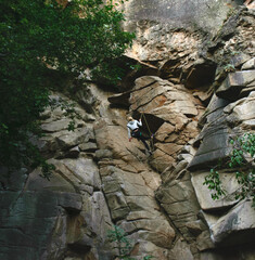 Woman climber on rock