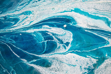 Abstraction. Ocean. Sea. Fluid art. Natural luxury. The style includes swirls of marble or ripples of agate. Very beautiful blue paint with the addition of gold powder