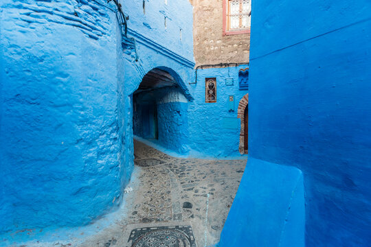 Alley at houses painted in blue at Chefchaouen, Morocco