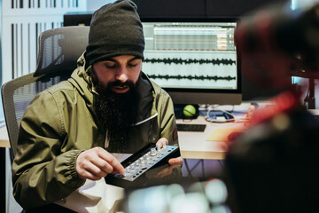 Dj making a video tutorial in his studio