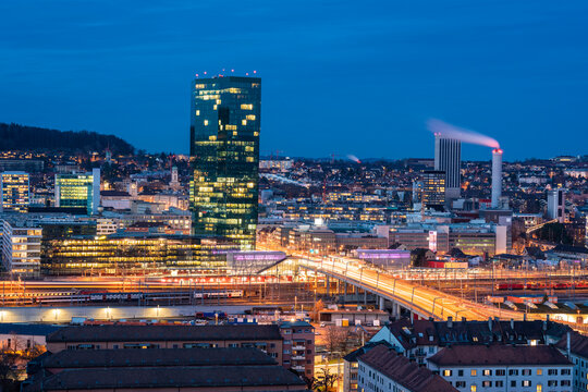 Switzerland, Zurich, Cityscape with Prime Tower and Hard Bridge illuminated at night
