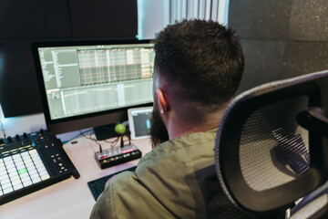 Dj producing music in his studio