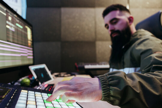 Dj producing music in his studio