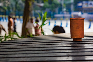 earthen tea cup on a wooden table. leisure time