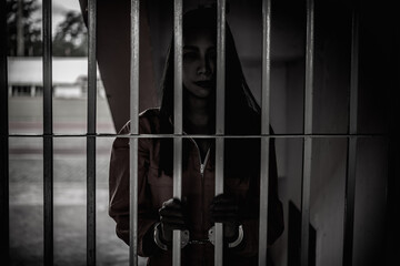 Hands of women desperate to catch the iron prison,prisoner concept,thailand people,Hope to be...