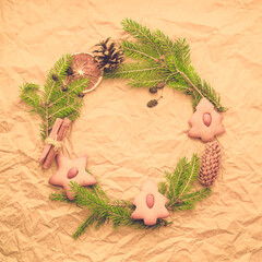 Traditional winter garland  on evergreen green branches.
