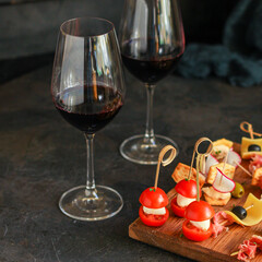 glass of wine and snack canapes cheese vegetables snack
plate serving size natural product portion top view place for text copy space food background rustic