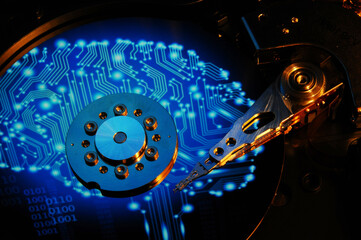 Closeup of open Computer Hard Disk Drive with blue electronic circuit reflected on the disc surface. Wallpaper Background.