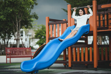 Asian woman smiling having fun at playground outdoor