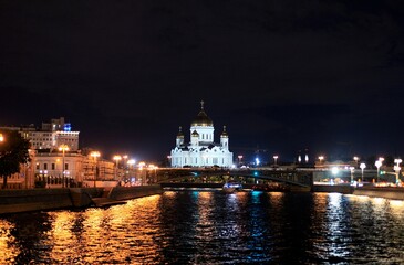 Panorama of the night city with neon lights. Cathedral of Christ the Savior at night