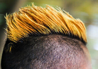 mohawk hair style close up view with yellow dye of hair
