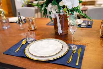 Beautifully laid tables with glasses and appliances in restaurant.