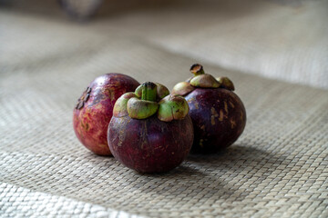 Mangosteen fruit on a pandanus mat