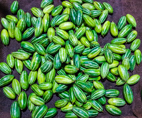 heap of potol parwal pointed gourd in vegetable market for sale