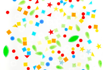 coloreful plastic shapes on white background