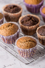 Sweet cakes or cupcakes on light marble background. Holiday cake celebration, delicious dessert, close up