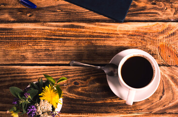 coffee ,flowers on wood background