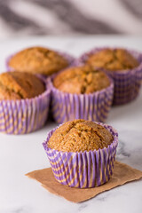 Sweet cakes or cupcakes on light marble background. Holiday cake celebration, delicious dessert, close up