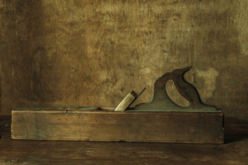 Old large Shaving plane on a wooden table in retro style