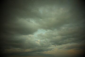 Naklejka na ściany i meble Gray cloudy sky as background. Dramatic sky.