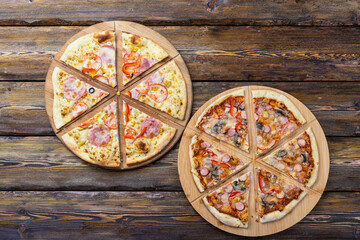 cutting board with hot testy pizza on wooden background,top view 
