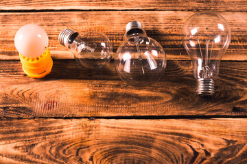 bulbs concept on the brown wooden background