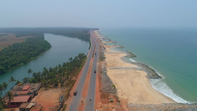 ratmalana south india river an coconut farm and road droen shot.