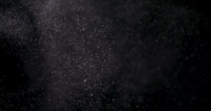 White dust powder isolated on black background