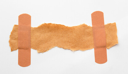a piece of paper for the inscription glued with adhesive plaster, copy space