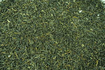 Dry green tea on a background