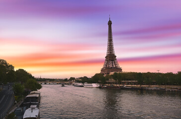 Fototapeta na wymiar Sunset over the the Eiffel Tower and the Seine River in Paris, France.