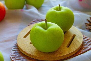 Green apples close up on wood surface