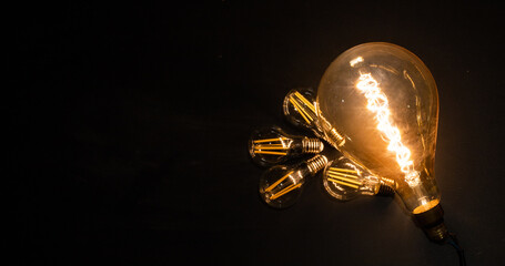 light bulbs on dark background idea and innovation