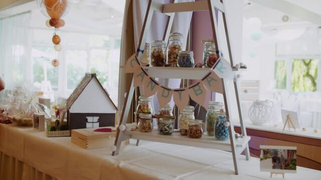 Selfmade Candy bar at wedding with colourful candy in glases