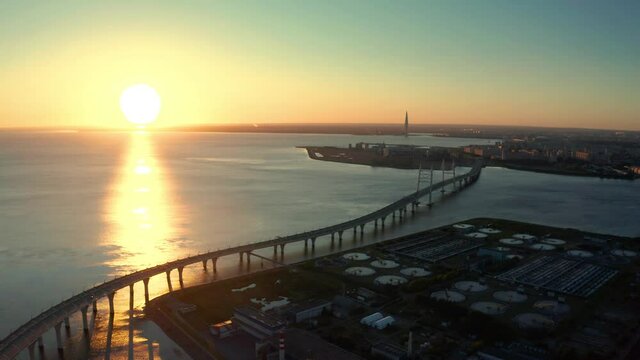 High-speed toll road, highway bypassing the city center St. Petersburg, the central section of the western high-speed section. A beautiful view of the sunset over the Gulf of Finland.