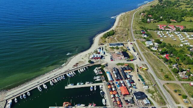 Sailboats And Fishing Boats Anchored On The Harbor In B&ouml;da Socken In Byxelkrok A Fishing Village In &Ouml;land, Sweden.  - aerial drone shot