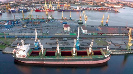 Aerial view of cargo ship, cargo container in warehouse harbor in the Morskie Vorota district in St. Petersburg.