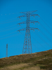 high tension metal towers in the mountain area