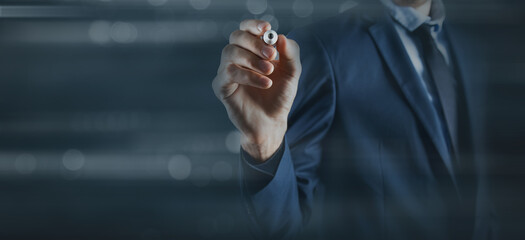Fototapeta premium Business man writes on a touch screen