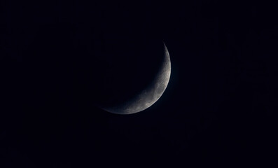 Obraz na płótnie Canvas Sickle shaped moon on the night sky