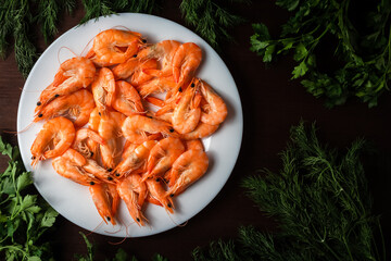 seafood shrimp on a plate decorated with herbs