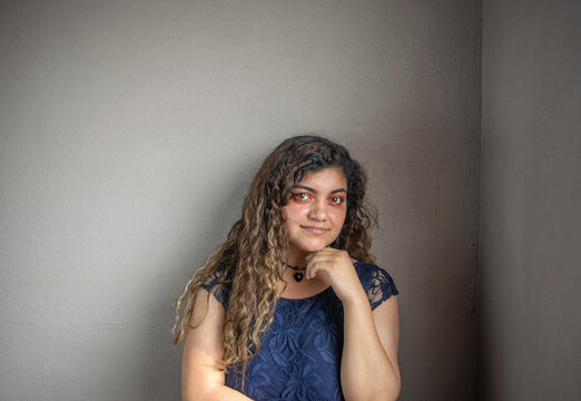 portrait of beautiful latin mexican woman looking at camera. chubby girl