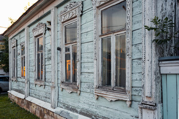Fototapeta na wymiar wooden Windows with beautiful architraves