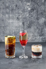 Cocktails - cuba libre, whiskey sour and a sparkling wine with strawberry