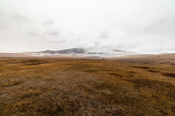 Dreary, foggy, empty, and barren winter landscape at the National Bison Range wildlife refuge, Montana, USA