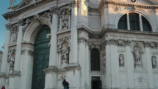 Facade of Santa Maria della Salute church in sunset time,