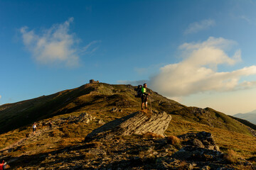 A young man descends from the top of the mountain Pip Ivan, observes the epic landscapes around the...