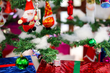 christmas decoration with gift bells balls boxes boots stars with christmas tree and cotton with blurred background