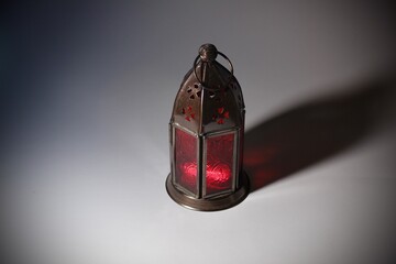 Red Antique lamp With shadows on white background